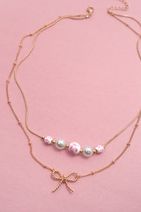 Pearl and Bow Layered Necklace in Gold