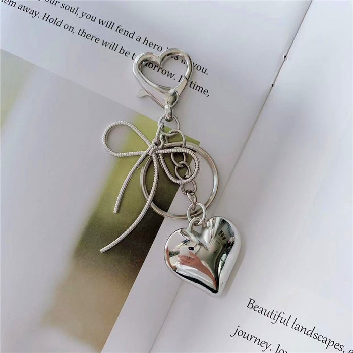 Bow and Heart Bag Charm in Silver