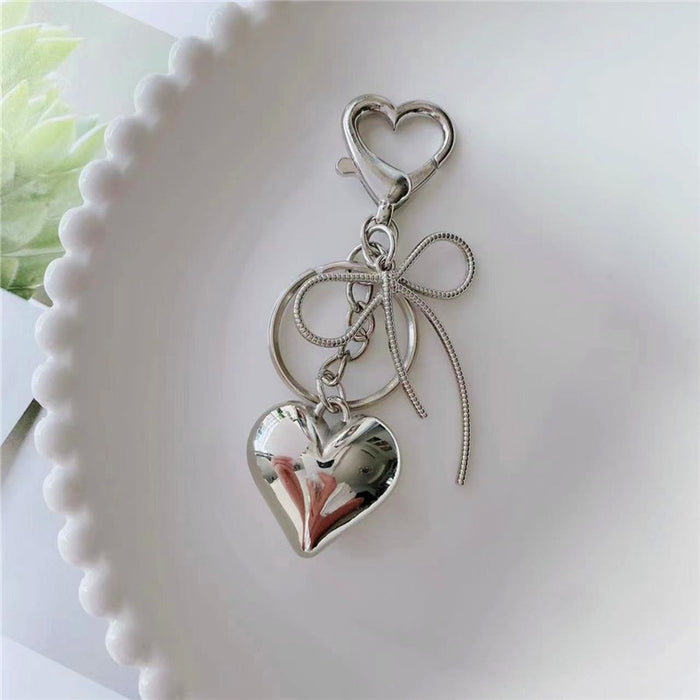 Bow and Heart Bag Charm in Silver