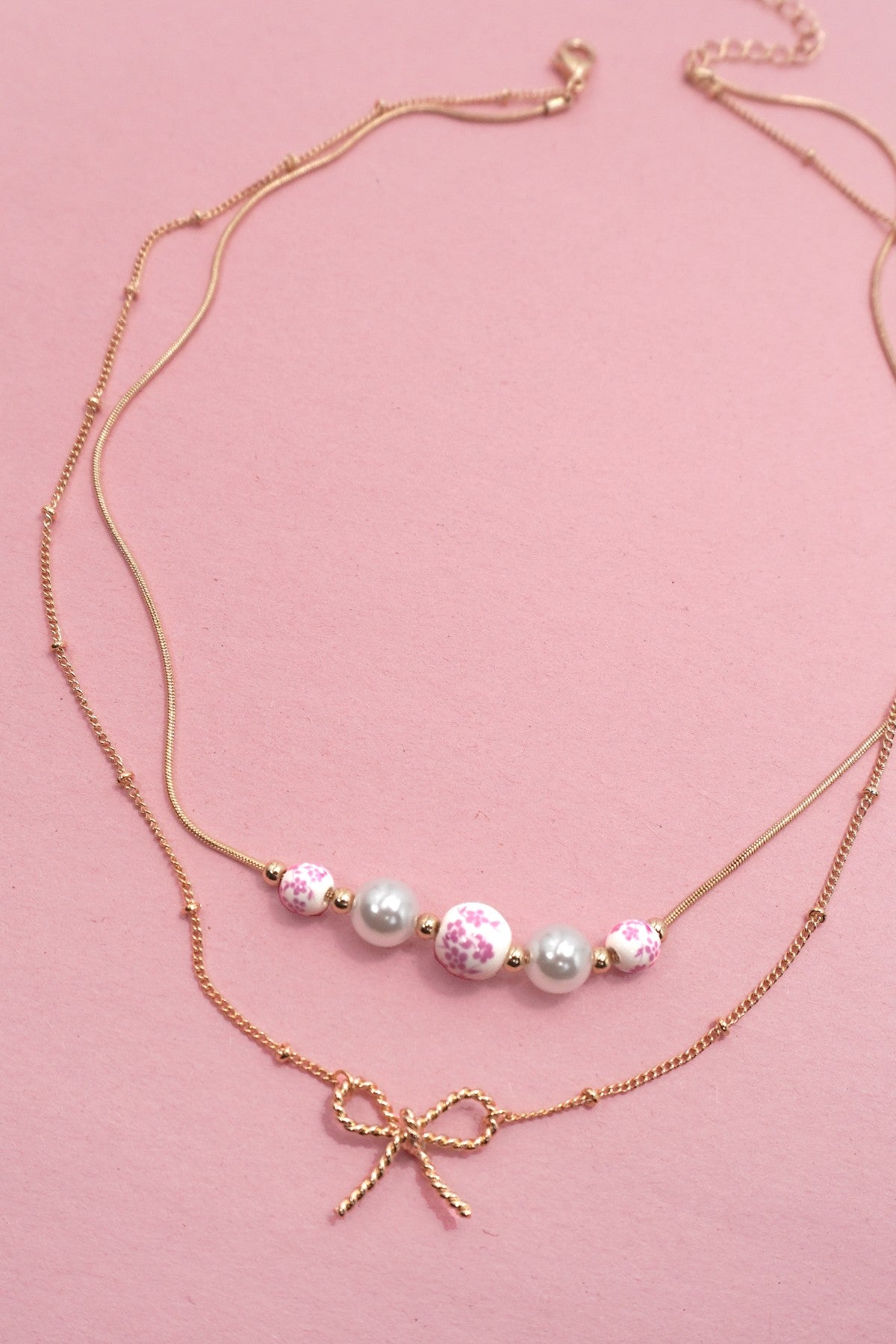Pearl and Bow Layered Necklace in Gold