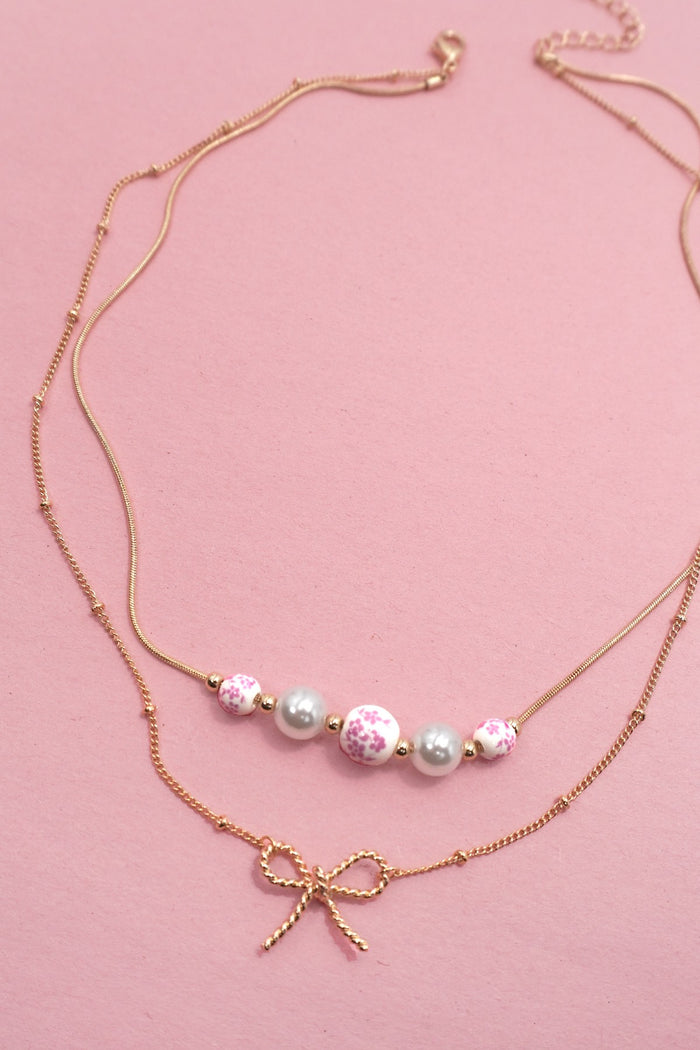 Pearl and Bow Layered Necklace in Gold