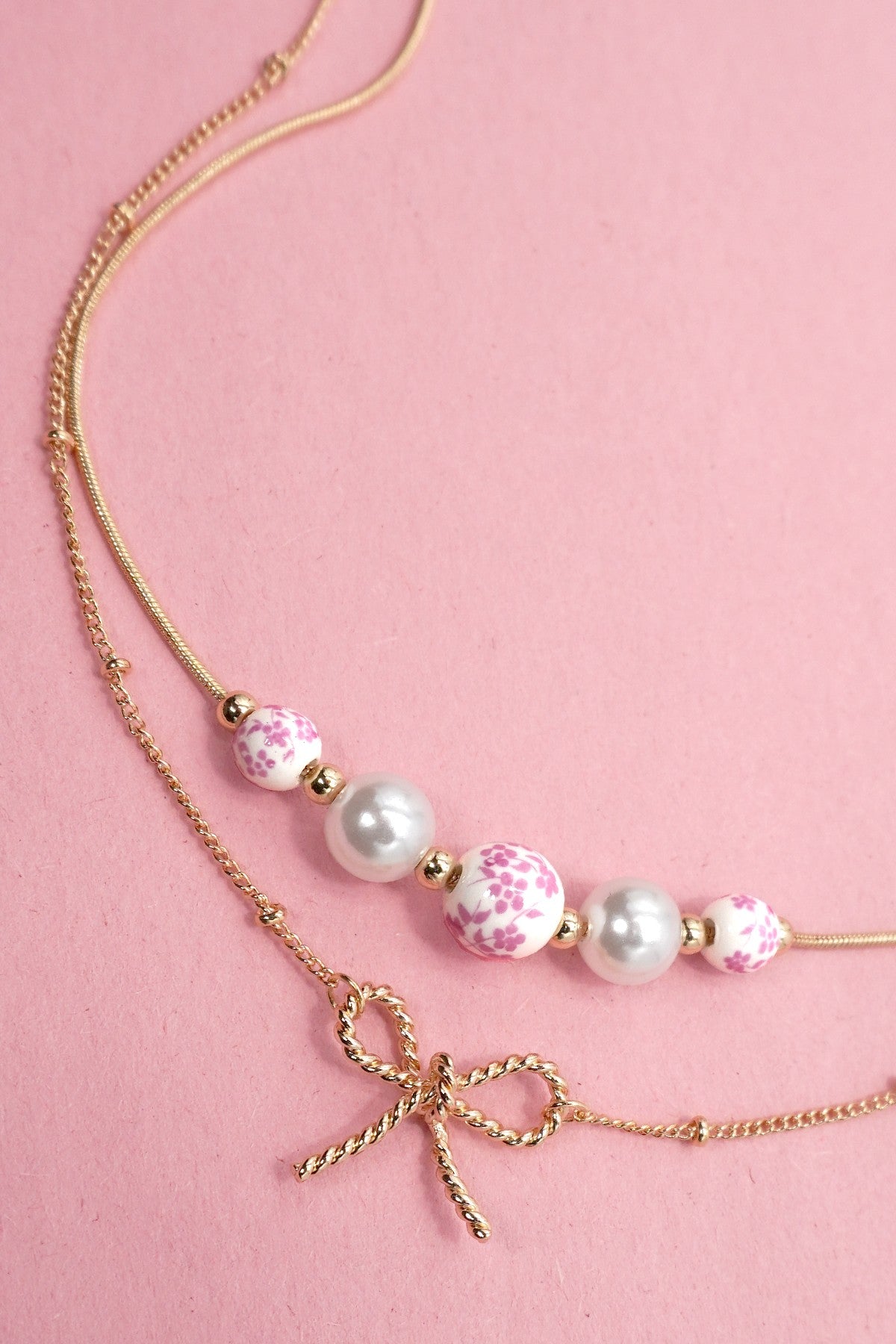 Pearl and Bow Layered Necklace in Gold