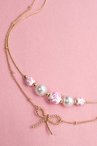 Pearl and Bow Layered Necklace in Gold