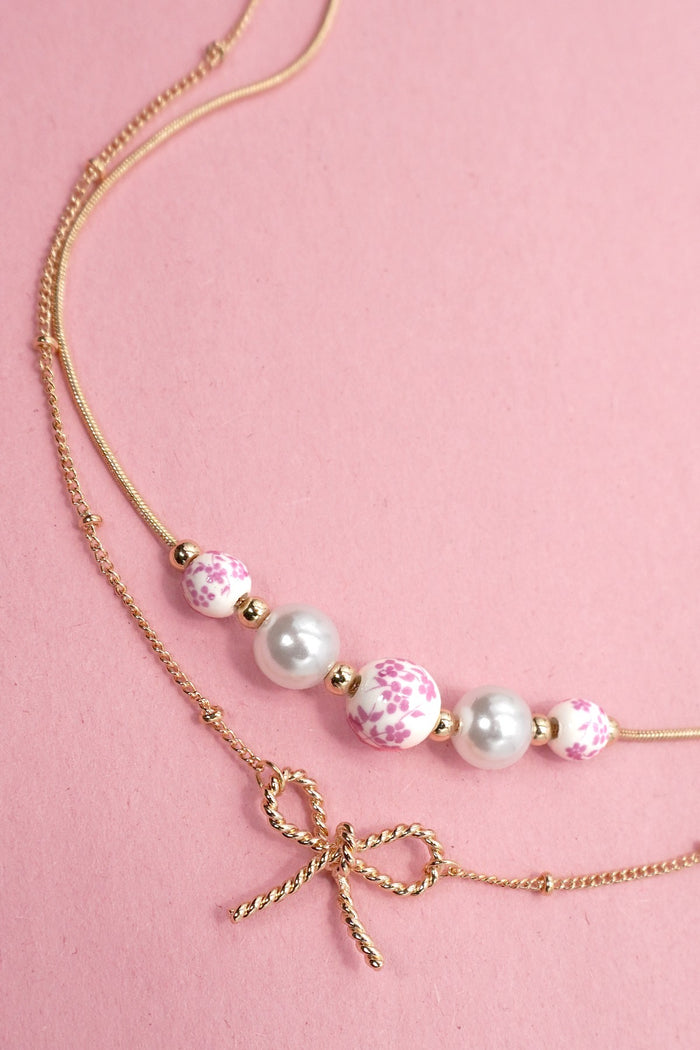Pearl and Bow Layered Necklace in Gold