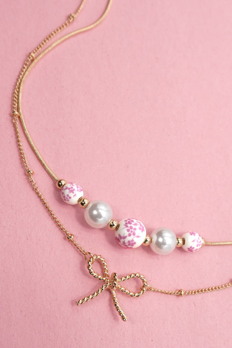 Pearl and Bow Layered Necklace in Gold