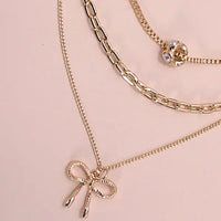 Multi Layer Bow Necklace in Gold