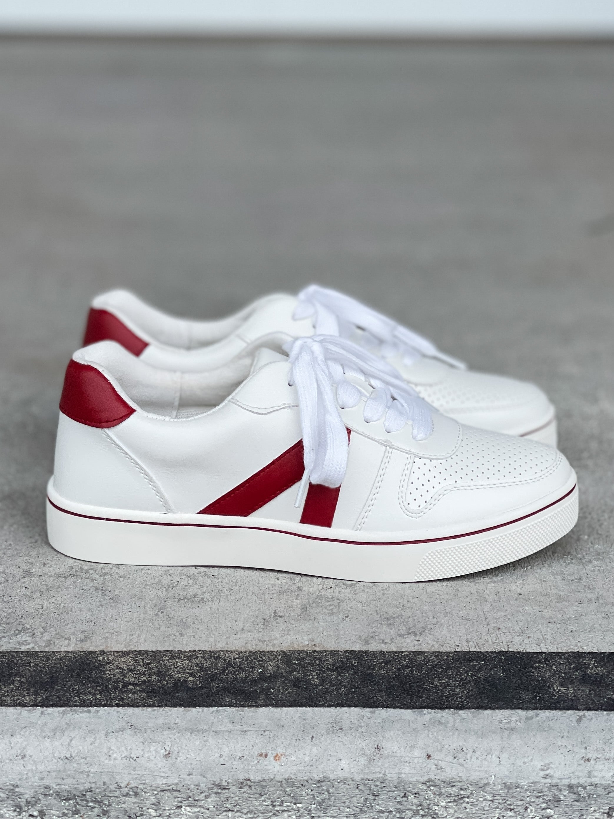 White sneakers with red on sale stripe